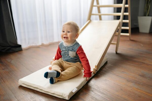 Toddler Enjoying A Slide